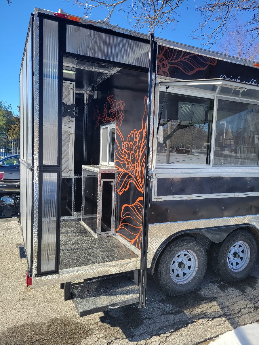The enclosed walk-in porch at the back of the trailer